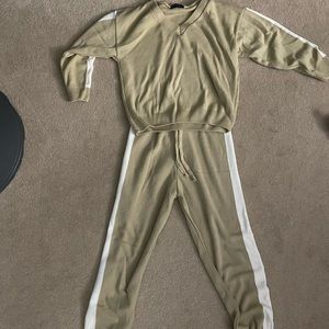 Two piece jog set. Size small fits like a medium. Pants are high waisted